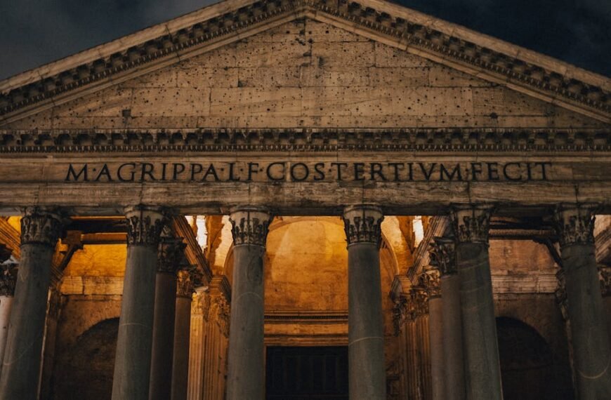 Capturing the impressive illuminated front of the Pantheon in Rome during a serene night.