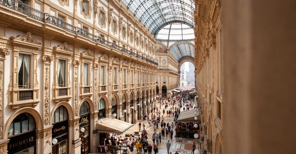 Interior view of Galleria Vittorio Emanuele II in Milan, showcasing its stunning architecture and bustling crowds.